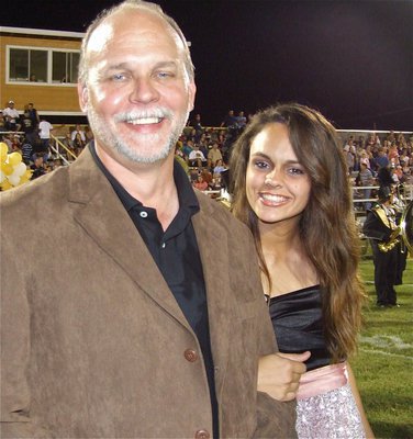 Image: Proud dad — James Viers escorts his daughter Anna Viers, who is a 2010 Homecoming Princess, out to centerfield.