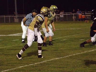 Image: Welcome to the jungle — Gladiators Corrin Frazier(25) and Kyle Wilkins(7) are surrounded by Zebras and Jaguars.