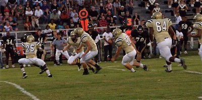 Image: No place to run — Corrin Frazier(25), Jase Holden(6), Kyle Wilkins(7), Ethan Simon(50), Bobby Wilson(64) and De’Andre Rettig(60) converge on a Jaguar receiver.