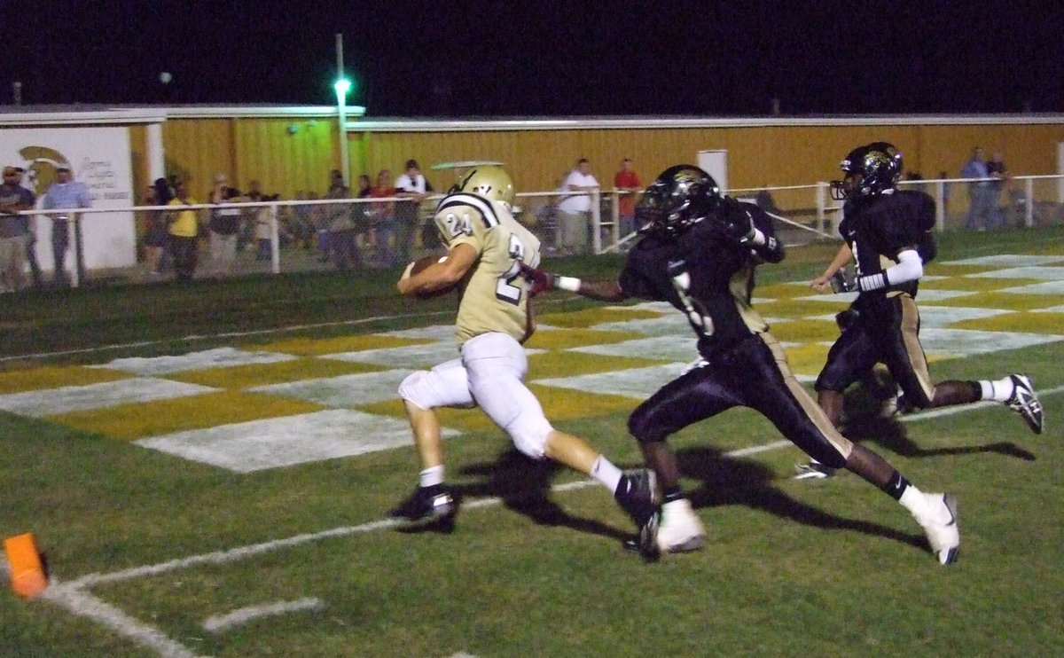 Image: Who’s Chasing who? — Chase Hamilton (24) runs into the endzone to score a touchdown in the last quarter.