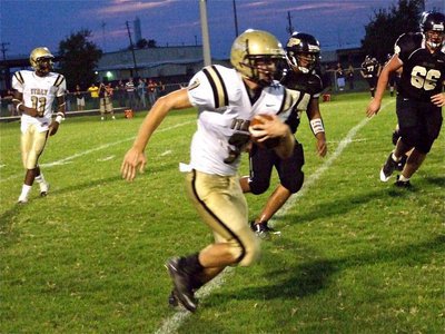 Image: Kyle kicks it into gear — Kyle Wilkins(7) finds a running lane and turns Palmer’s football field into a track race.