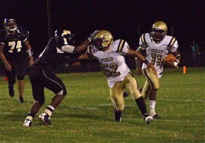 Image: Lopez blocks — Offensive guard Jacob Lopez(52) leads the way for Jasenio Anderson(11).