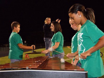 Image: Beat of Champions — Assistant Drum major Drenda Burk helps guide the Gladiator Regiment Band during the playing of Green Onions.