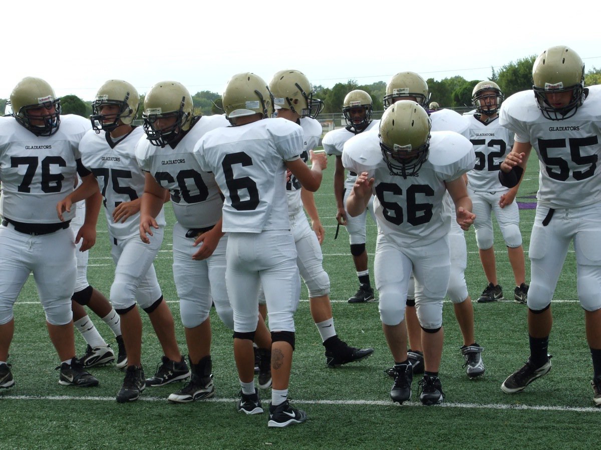 Image: Trying some plays — Italy’s offense practices plays before the game. Quarterback Tony Wooldridge(6) calls it and the offensive line consisting of Hank Seabolt(76), Cody Medrano(75), center Kevin Roldan(60), Jake Escamilla(66) and Zackery Boykin(55) do their best to execute.