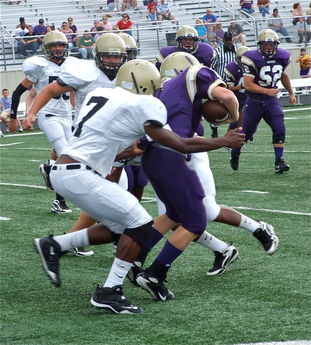 Image: Paul’s got him — Paul Harris hangs on to a Panther runner to destroy a Mart reverse play.