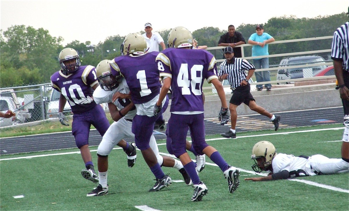 Image: Panthers score — Italy’s safety Trey Robertson(9) delivers the hit but the momentum carried the Panther runner into the endzone.