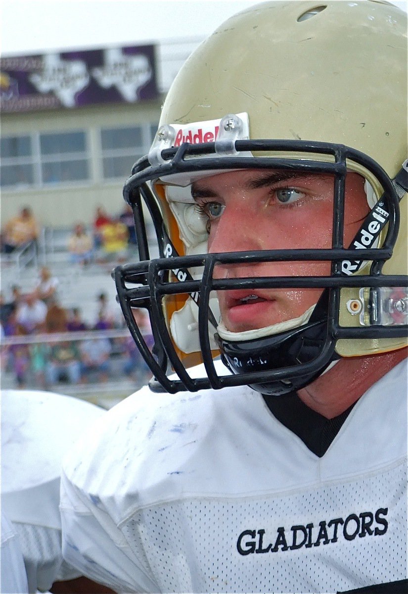 Image: Eyes on coach — Zackery Boykin intently listens to coach Stephen Coleman during a break in the action.