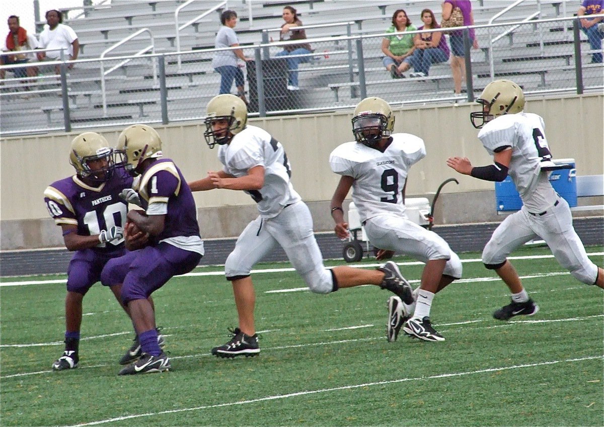 Image: Catching a Panther — Cody Medrano(75) makes a touchdown saving tackle by catching the Panther runner from behind.