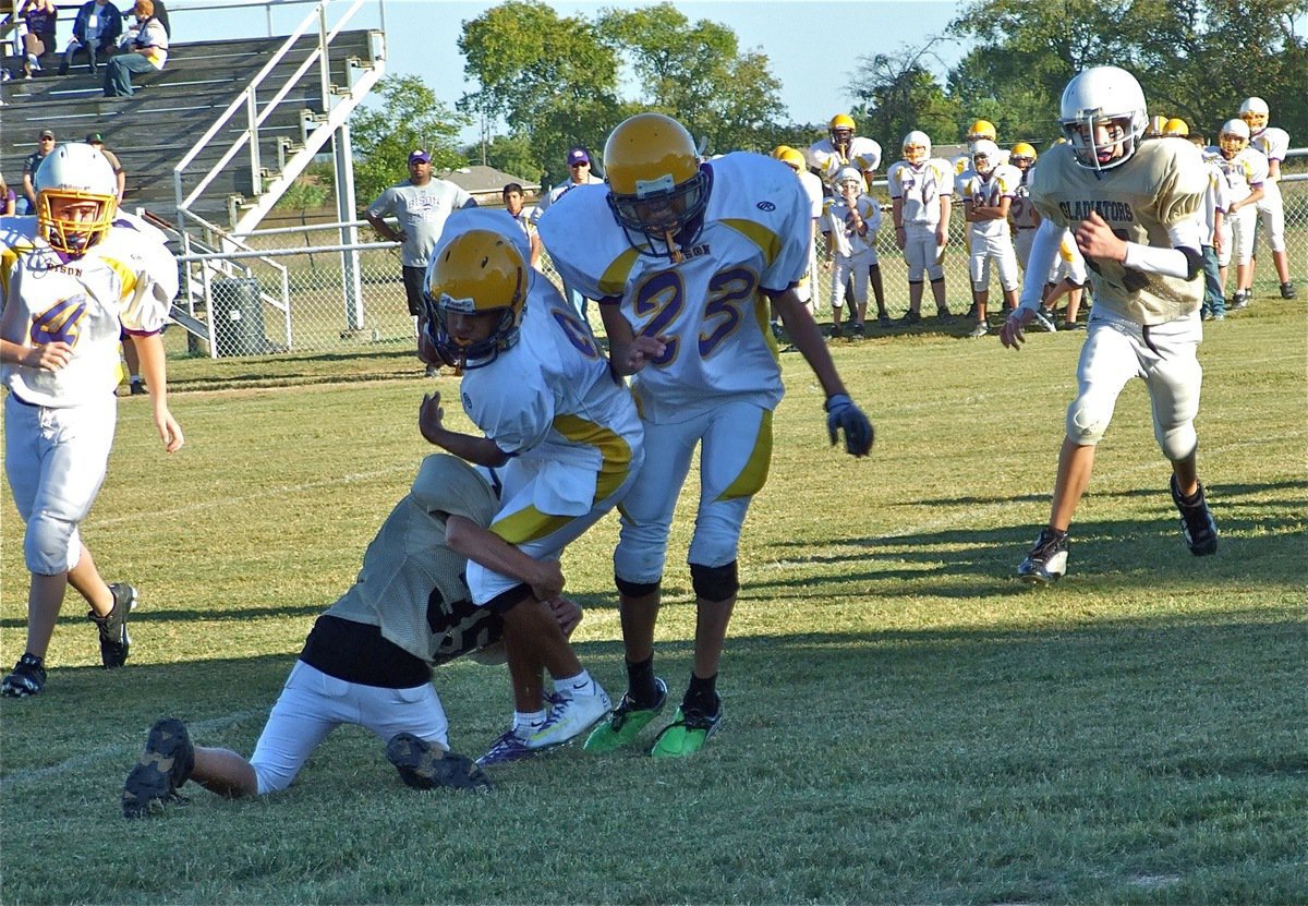 Image: Solo tackle — Caden Petrey(35) avoids the lead block and takes out the legs of the Bison running back.