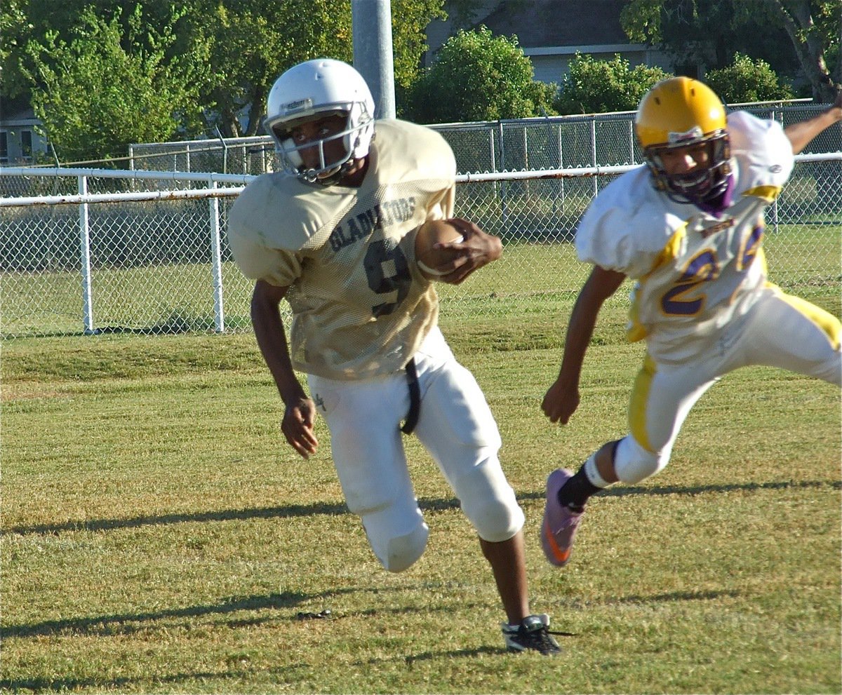 Image: JaRay gets away — JaRay Anderson(9) escapes the Buffalo herd.