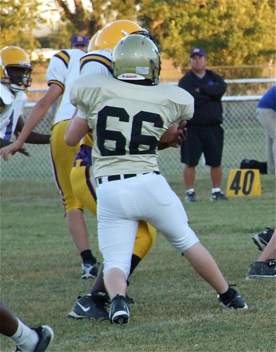 Image: Jake has power — Italy’s Jake Escamilla(66) controls the blocker in front him.