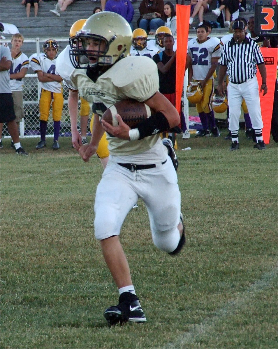 Image: Run, Tony, run! — Quarterback Tony Wooldridge(6) runs for daylight against the Bison defense.