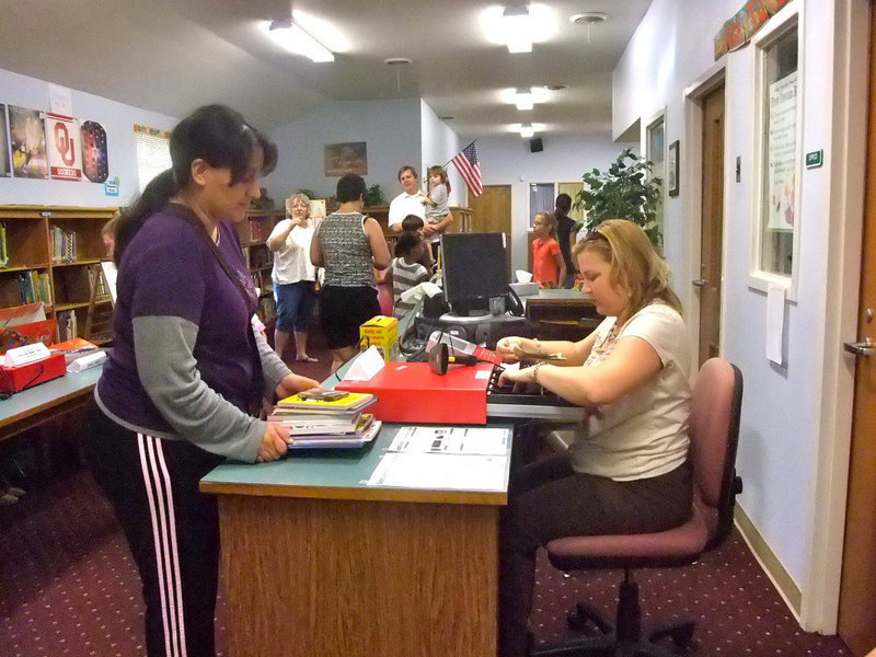 Image: Tessa South — Tessa South paying for the books the boys picked out!