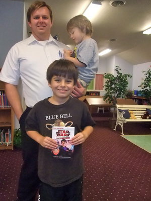 Image: Mike, Michael and Frankie — Mike South and his two boys were having fun picking out books.
