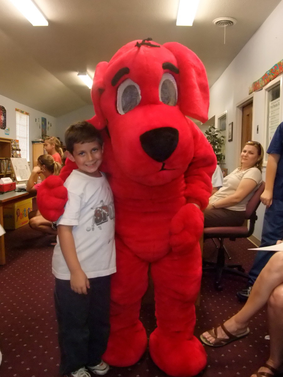 Image: Garrett and Clifford — Garrett Everette gave Clifford a great big hug.