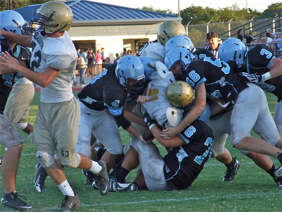 Image: Heath Clemons fights for the endzone — Italy Gladiator Brandon Souder(62) tries to lead teammate Heath Clemons across the goal line and thru a pack of Waco Reicher Catholic Cougars during a Varsity scrimmage in Waco on Friday.