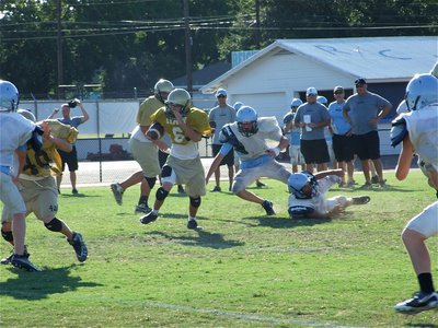 Image: Room to run — JV quarterback Tony Wooldridge(6) escapes pressure in the backfield and picks up yardage for Italy.