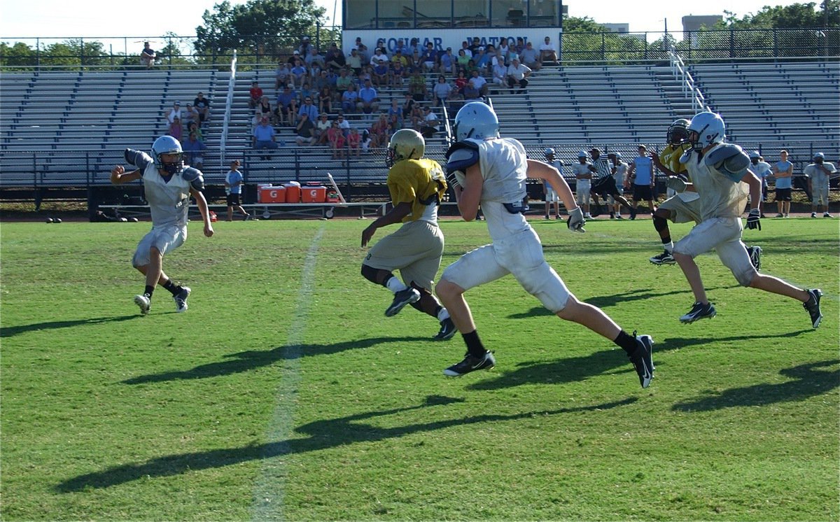 Image: In the open — Jalarnce Jamal Lewis cuts back in the open field to go the distance for the JV Gladiators.