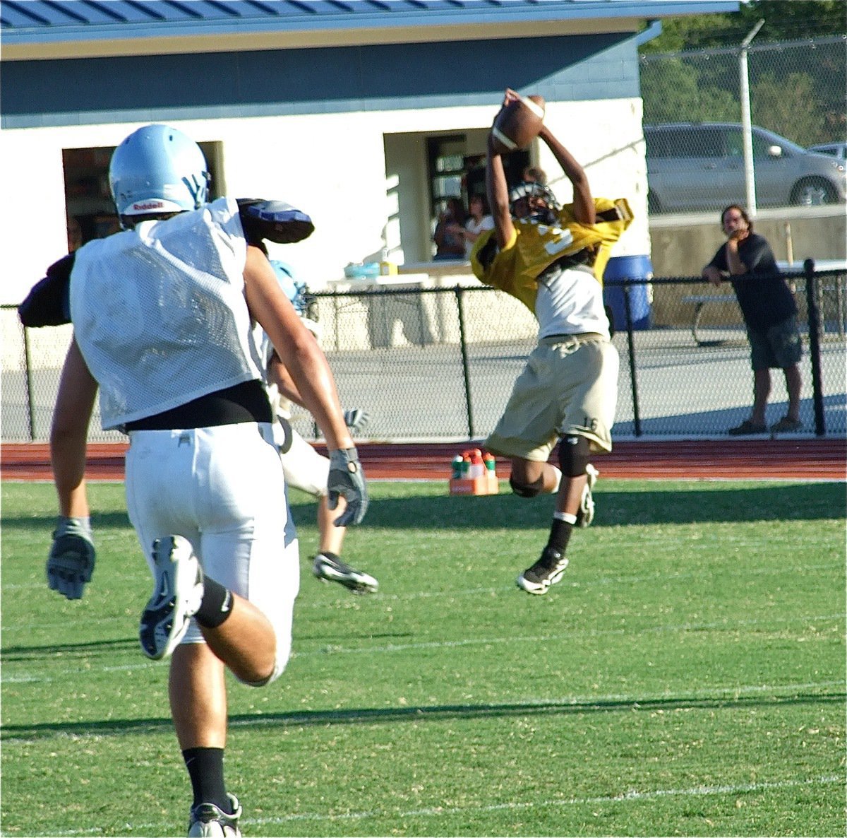 Image: Air show — High-flying Trevon Robertson grabs air and the pigskin for a catch to move the chains.