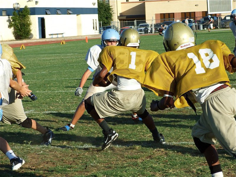 Image: I wanna be like Mike — Michael Clark(1) jukes his way for a nice gain against the Cougars. Clark would later add a touchdown run to his accomplishments.