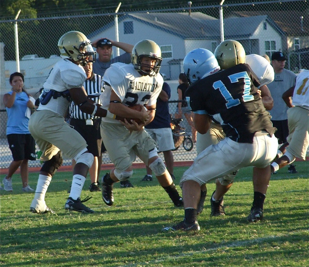 Image: Kyle looks for a lane — Jasenio Anderson handsoff to Kyle Jackson during the Varsity scrimmage with the Reicher Cougars.