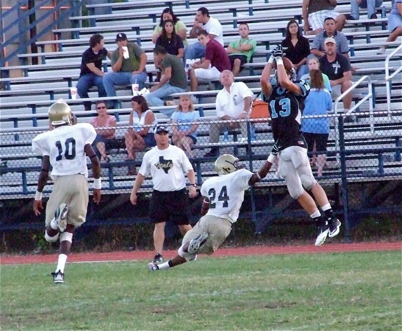 Image: He pushed off — Italy assistant coach Josh Ward looks on as De’Andre Sephus(24) and Devonta Simmons(10) try to disrupt this Waco Reicher receiver who makes the catch. The catch was nullified, however, thanks to an offensive pass interference call.