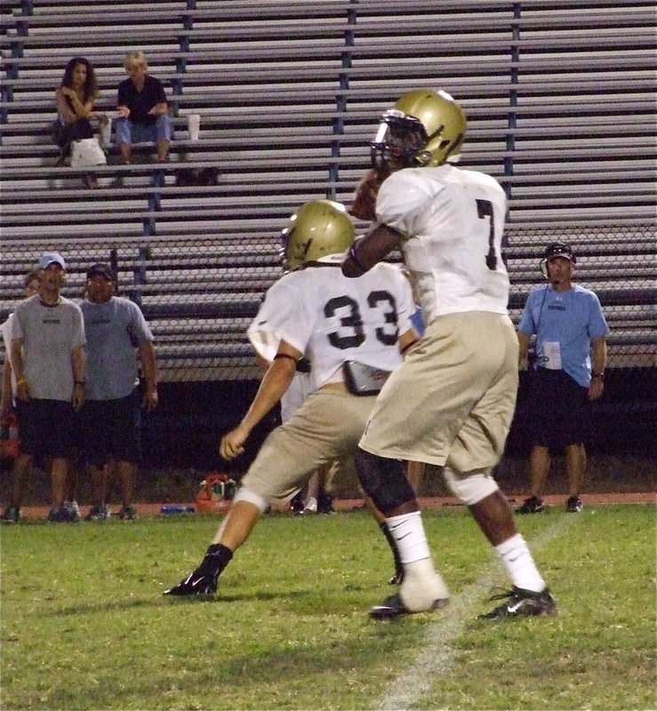 Image: In the pocket — Jasenio Anderson(7) sets to pass behind his bodyguard Kyle Jackson(33).