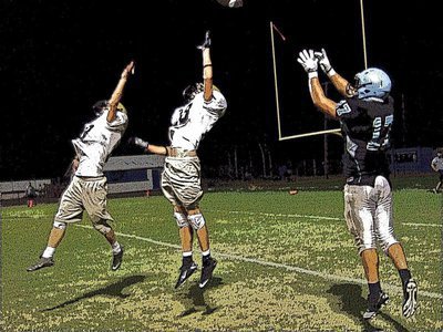 Image: Credit the Cougars — Reicher completes a pass over two outstretched Gladiators to score their second touchdown during the live quarter simulation.