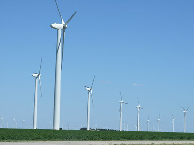 Image: Renewable energy and cotton — Wind farms are abundant in the western corridor of Texas.  One of the largest farms in the nation is located in Roscoe County and cotton is still the king.