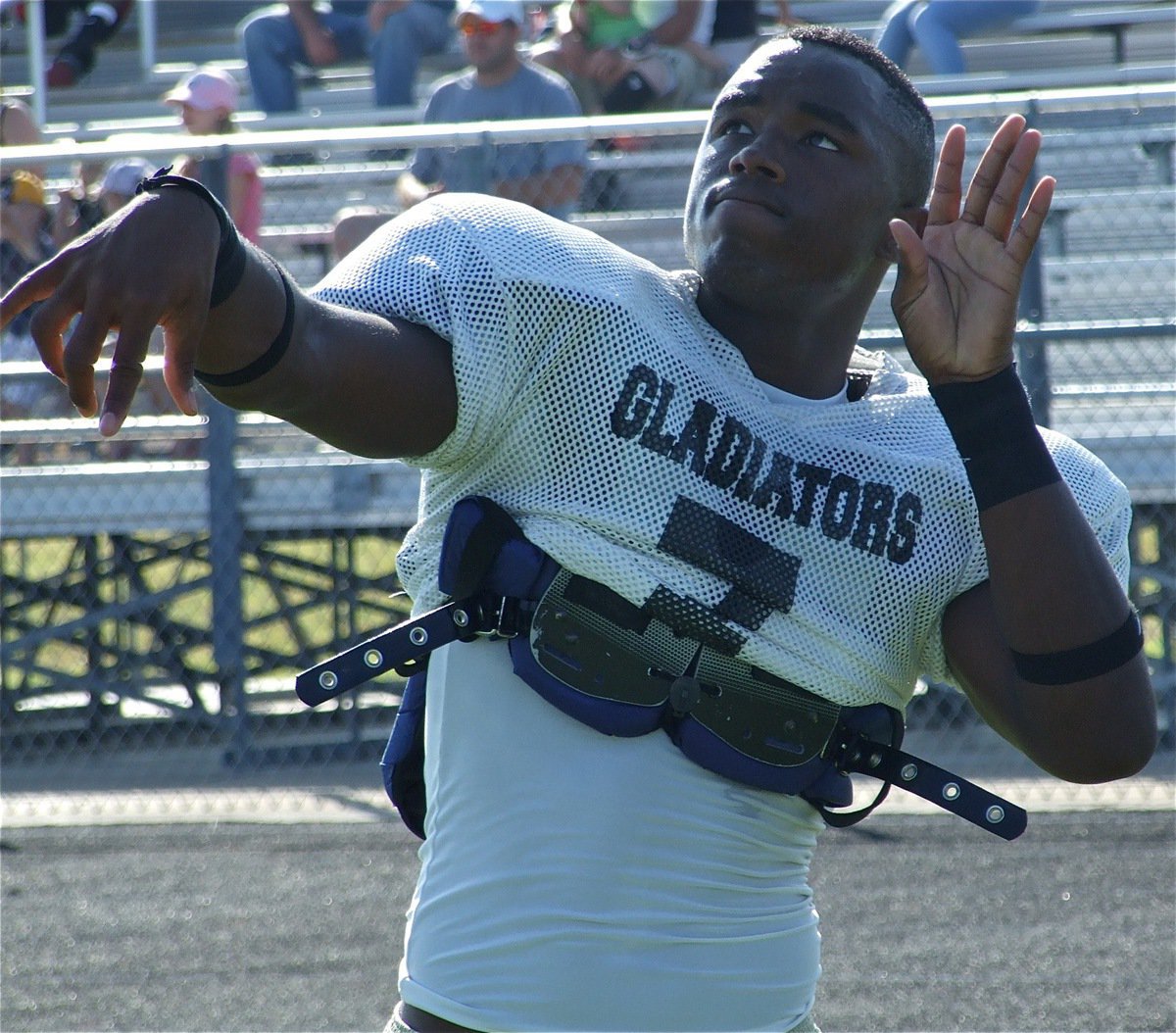 Image: Aiming high — Jasenio Anderson adjust his sights to ensure precise aim before the scrimmage against Valley Mills.