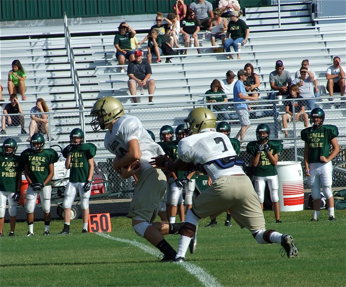 Image: Kyle takes off — Kyle Wilkins takes the handoff from Jasenio Anderson.