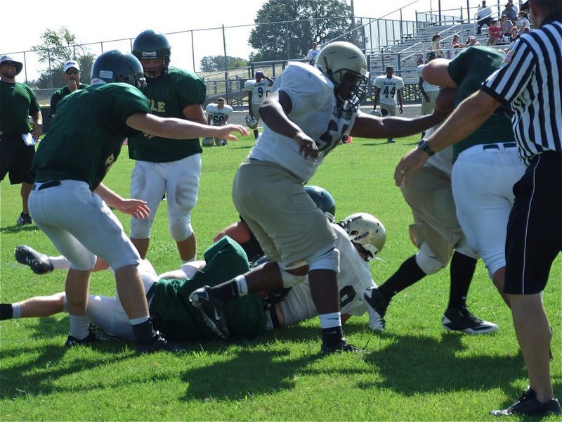 Image: 2-0 Italy — Gladiators’ linemen Bobby Wilson(50) and Jacob Lopez push the Valley Mills defense back allowing Justin Buchanan to fight his way into the endzone for Italy’s second score of the scrimmage.