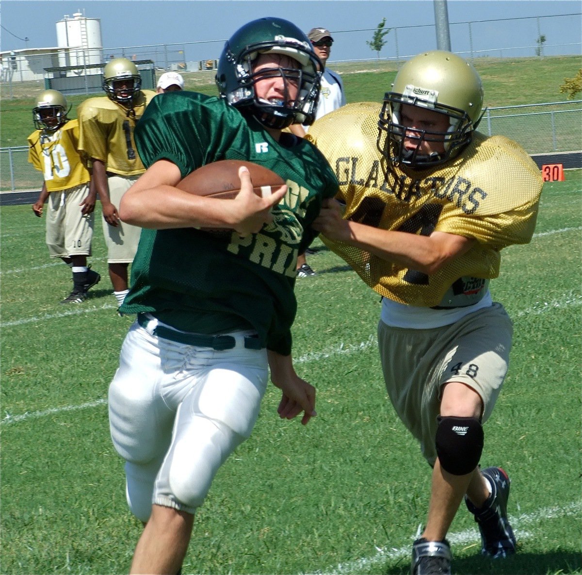 Image: Like a hawk — Justin Wood tracks down an Eagle runner and tackles him by grabbing his wing.