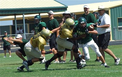 Image: Exclamation point! — The Italy JV wraps up a strong outing as Paul Harris(88) makes a tackle in the Valley Mills backfield to end the scrimmage. Italy’s JV team outscored the Eagles 2-0 during the scrimmage.
