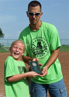 Image: Fun in the sun — IYAAs baseball/softball town representative Stephen Mott presents the 3rd Place trophy to an ecstatic Diamond Diva.