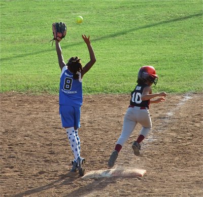 Image: Reaching first — The Ferris Scorpions capitalize on Milford’s misfortunes to hand Milford their first loss of the season, 13-4, forcing an extra game to decide the district tournament champion.