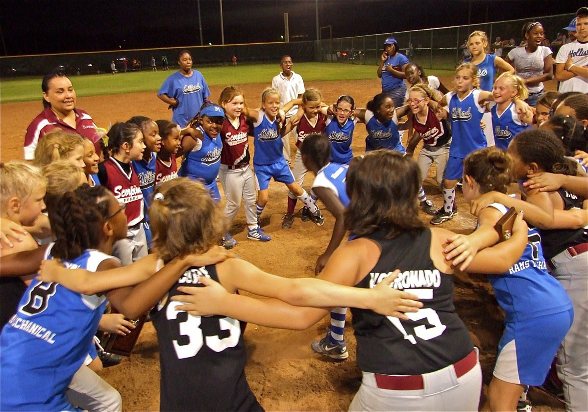 Image: Good sports — In a show of sportsmanship, the Milford Lil’ Dogs and the Ferris Scorpions share in a victory chant after the game. Good luck to both teams in the state tournament.