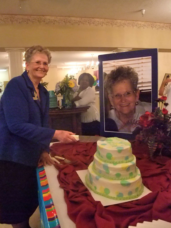 Image: Cake Anyone? — Marie is ready to cut the cake!