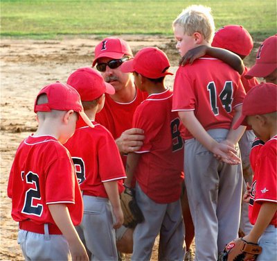 Image: “Everybody in!” — Coach Charles Hyles tries to motivate his IYAA T-Ball boys team before the division tournament championship game against Hillsboro.