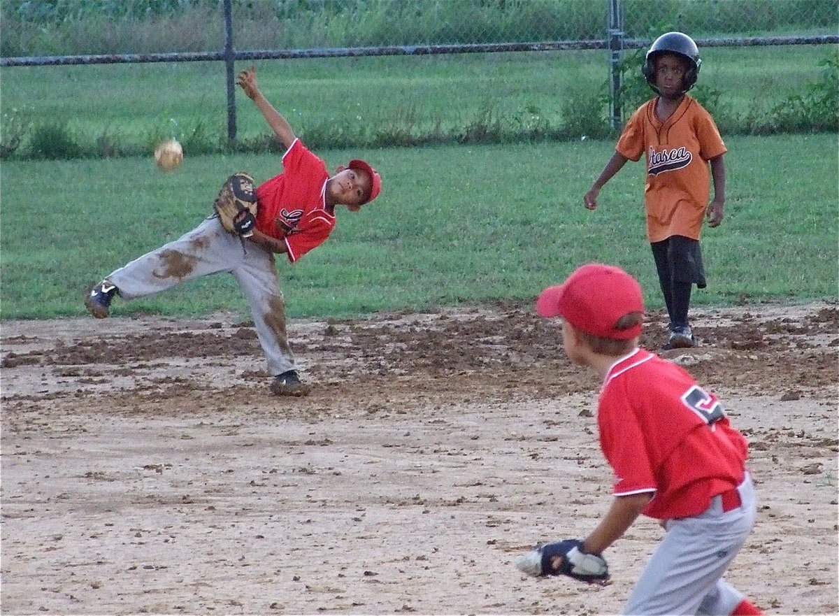 Image: What a throw! — Tylan Wallace throws into Chase Hyles to stop the play.