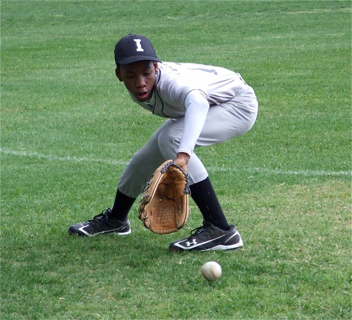 Image: Carson working hard — A multitalented Eric Carson has played shortstop, pitcher and catcher for the IYAA Gladdogs 14u boys baseball team.