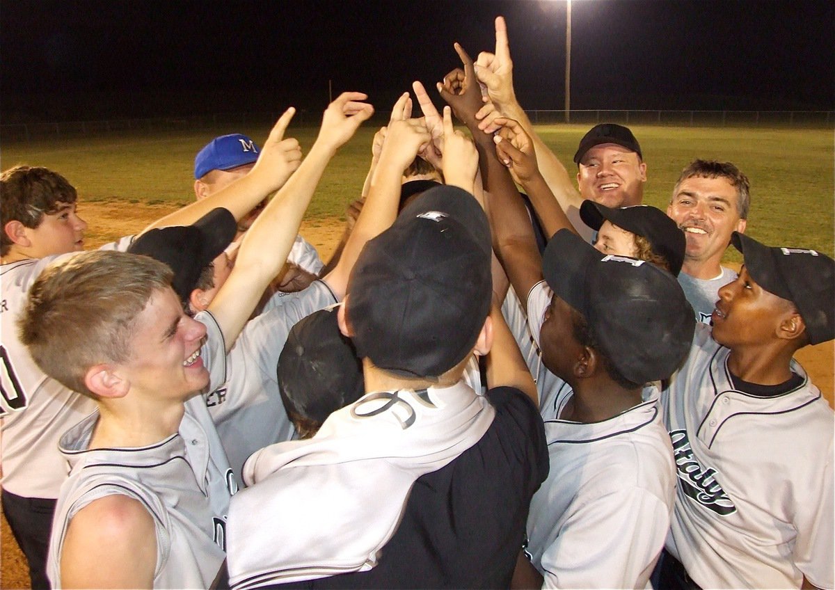 Image: The Champs! — Coaches Ty Evans, Lewis Essary and Barry Byers celebrate with their Gladdogs (14u boys) team after securing 1st place with a 6-homerun, 14-strikeout performance to win 14-2 over Whitney.