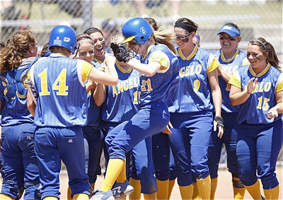 Image: Something to celebrate! — Sarah DeMoss and the Lady Rambelles celebrate a game winning home run that helped Angelo State maintain their National Championship hopes.