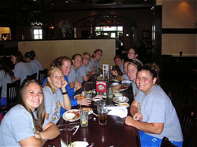 Image: The Rambelles relax — Sarah DeMoss, second from the left, enjoys a meal in Missouri with her Angelo State Lady Rambelles softball team.