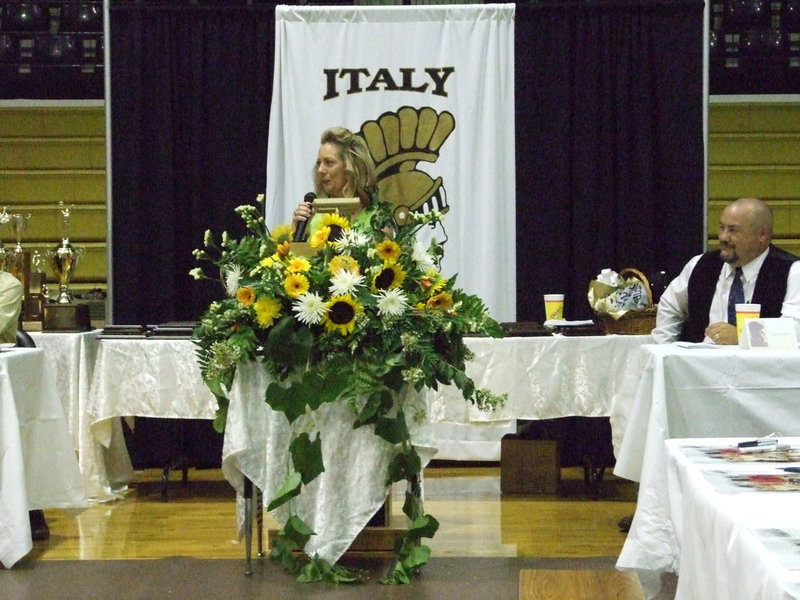 Image: A final welcome — President Becky Milligan welcomes friends, family, faculty and school board members to the annual Italy Athletic Booster Club banquet on Monday night.