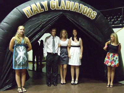 Image: All Gladiators — Collin, Courtney and Paige Westbrook are all Italy Gladiators.  Helping with the tunnel are Jr High Lady Gladiators, Jaclynn Lewis and Baily Eubank.