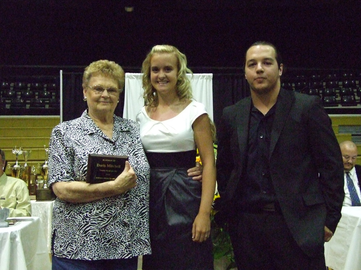 Image: Doris can cook — Uptown Cafe owner, Doris Mitchell, was presented a special recognition from Courtney Westbrook and Zach Hernandez.  Doris always had a meal hot from the kitchen for the Gladiators.