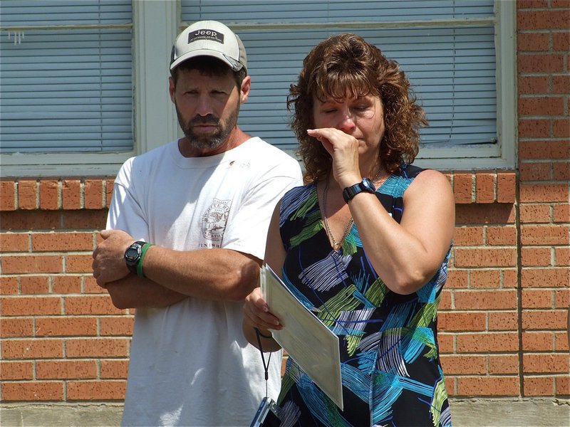 Image: Needing a moment — Sam Nance, Shelley’s father, comforts Cynthia during a difficult moment.