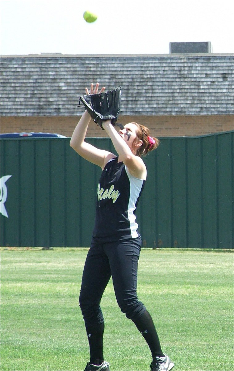 Image: Bailey catches — Italy sophomore Bailey Bumpus catches a fly ball before the showdown with Meridian and makes a catch during the game as well.