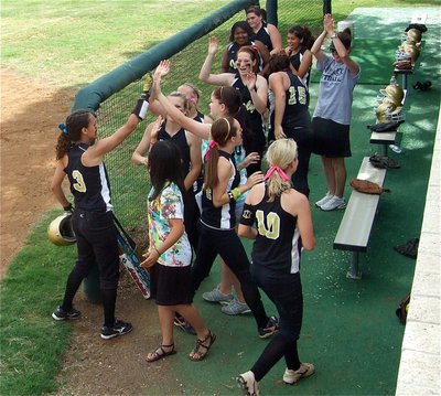 Image: Alright, Anna! — Freshman Anna Viers gets congratulated by the Lady Gladiator dugout after hitting a 2-run, inside the park, homerun against Meridian. The effort proved to be the game two winner as Italy went on to win 2-0.